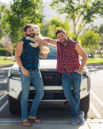 Jaymes Vaughan with his husband, Jonathan Bennett, and their dog.